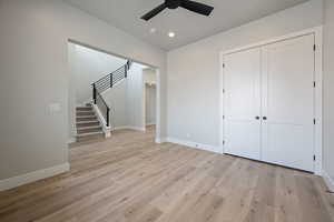 Interior space featuring baseboards, a closet, recessed lighting, and light wood-type flooring