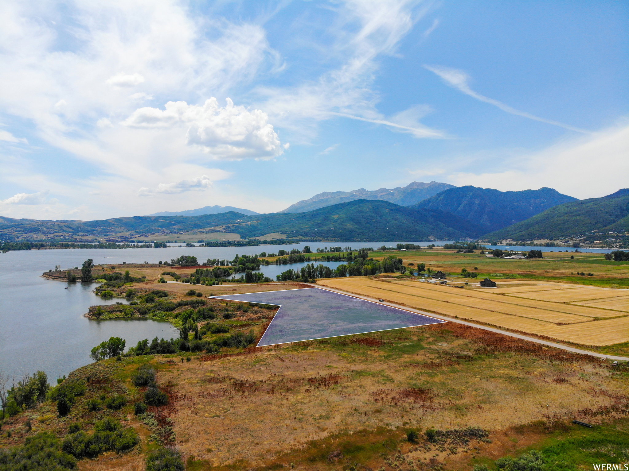 Property view of mountains with a water view