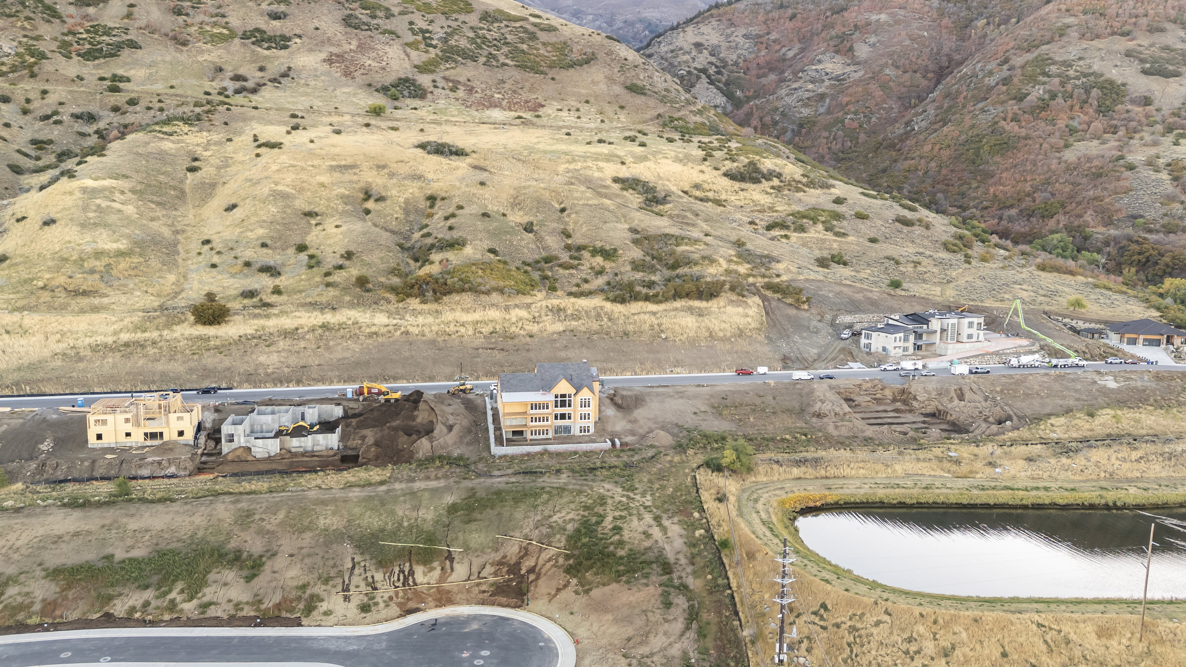 Aerial view of property and surrounding area with a nearby body of water