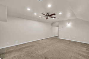 Empty room with carpet flooring, visible vents, recessed lighting, and a ceiling fan