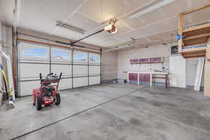 Garage featuring a garage door opener