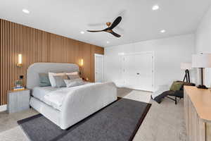 Bedroom featuring light carpet, a closet, recessed lighting, and a ceiling fan