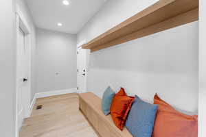 Mudroom with recessed lighting, baseboards, light wood-style floors, and visible vents