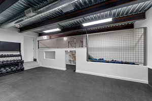Garage featuring baseboards and visible vents