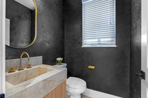 Bathroom featuring toilet and vanity
