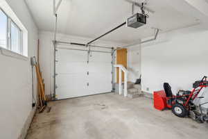Garage featuring a garage door opener
