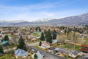 Birds eye view of property with a mountain view and a residential view