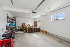 Garage featuring a garage door opener