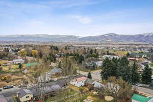 Birds eye view of property with a residential view and a mountain view