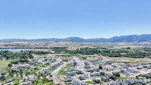 Aerial perspective of suburban area with a mountainous background