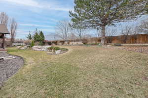 View of yard with a fenced backyard