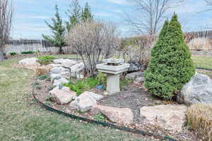 View of yard featuring fence