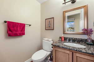 Half bath with toilet and vanity