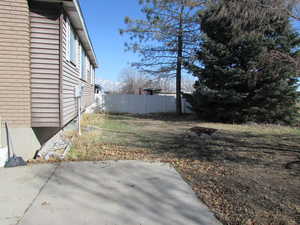 View of back yard featuring fence.