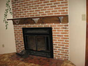 Interior details with a brick fireplace