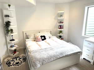 Bedroom with carpet floors and baseboards
