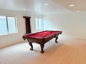 Rec room with plenty of natural light, ornamental molding, baseboards, and pool table