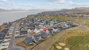 Birds eye view of property with a residential view and a water and mountain view