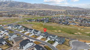 Bird's eye view with view of golf course, a residential view, and a mountain view