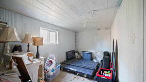 Bedroom featuring concrete floors