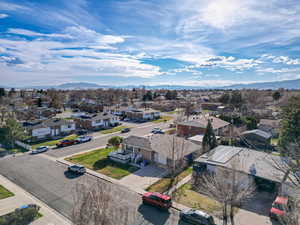 Birds eye view of property with a mountain view and a residential view