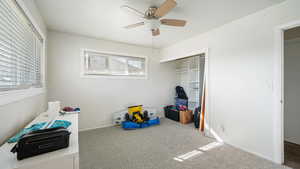 Interior space featuring baseboards, ceiling fan, and a closet