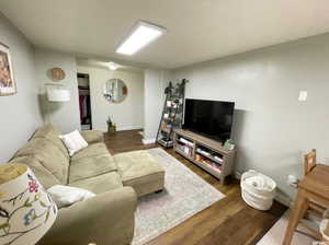 Living room featuring baseboards and wood finished floors