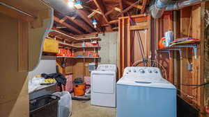 Unfinished basement with washing machine and dryer