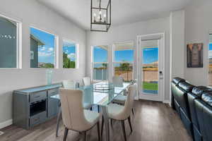 Dining room featuring lots of sunlight, and access to the back patio