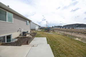 View of yard featuring a fenced backyard, a residential view, and a playground