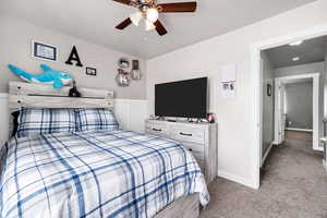 Bedroom featuring carpet flooring, a ceiling fan, and baseboards