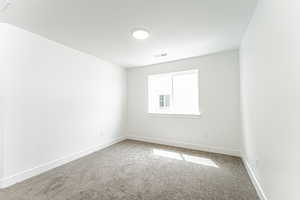 Empty room featuring carpet