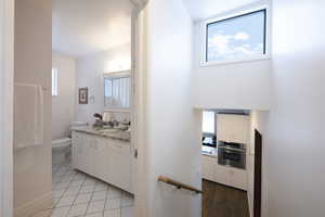 Bathroom with vanity and light tile patterned floors