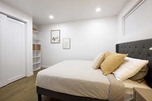 Bedroom featuring dark wood-type flooring and recessed lighting