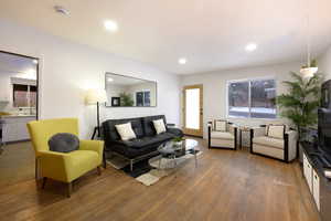Living room featuring wood-type flooring and recessed lighting