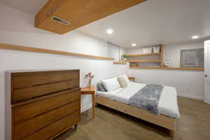 Bedroom featuring wood finished floors and recessed lighting