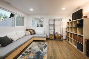 Living room featuring hardwood / wood-style floors and recessed lighting