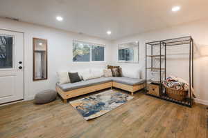 Living area featuring recessed lighting and wood finished floors