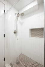 Bathroom featuring a shower stall