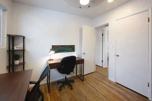 Home office featuring wood finished floors and baseboards