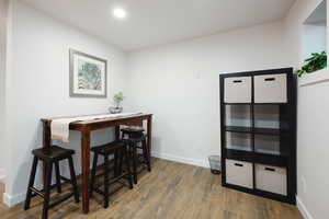 Dining room featuring wood finished floors and recessed lighting