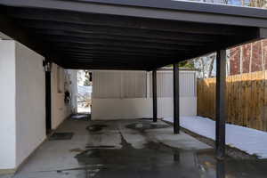 View of patio featuring a carport