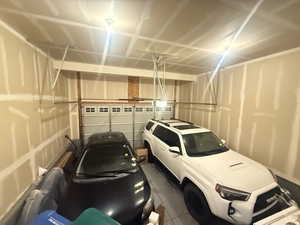Garage featuring a garage door opener