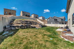 View of yard featuring a pergola, a patio area, a fenced backyard, and a residential view