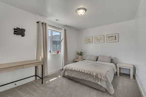 Bedroom featuring carpet flooring, baseboards, and visible vents