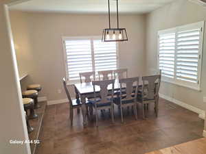 Dining area with baseboards and visible vents