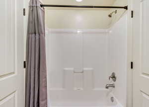 Bathroom featuring shower / tub combo