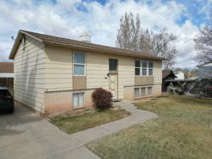 Split entry home exterior with concrete driveway