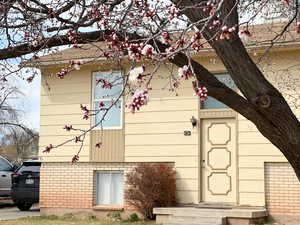 View of home's exterior with brick  and siding