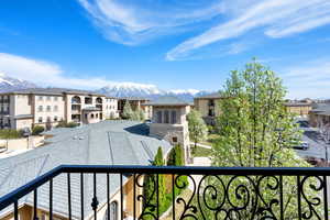 Balcony featuring a residential view and a mountain view